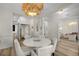 Formal dining room showcasing a white table and a stunning chandelier at 11401 Camden Park Dr, Windermere, FL 34786