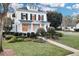 Two-story white house with black shutters, walkway and manicured landscaping at 11401 Camden Park Dr, Windermere, FL 34786