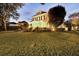 Well-manicured lawn and landscaping in front of a two-story house at 11401 Camden Park Dr, Windermere, FL 34786