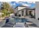 Exterior view of the home with a pool, lounge chairs, and outdoor grilling area at 11413 Camden Park Dr, Windermere, FL 34786