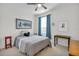Cozy bedroom featuring natural light, blue curtains, and stylish decor at 11413 Camden Park Dr, Windermere, FL 34786