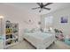 Bright bedroom featuring a comfortable bed and built-in shelving at 11413 Camden Park Dr, Windermere, FL 34786