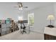 Office with natural light, a ceiling fan and shelving with storage at 11413 Camden Park Dr, Windermere, FL 34786