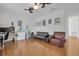 Comfortable bedroom features hardwood floors, a cozy seating area, and plenty of natural light at 11413 Camden Park Dr, Windermere, FL 34786