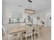 Elegant dining room with a modern chandelier, stylish buffet, and a comfortable table with seating, perfect for Gathering meals and gatherings at 11413 Camden Park Dr, Windermere, FL 34786