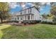 Two-story home with front porch and landscaped yard at 11413 Camden Park Dr, Windermere, FL 34786