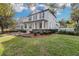 Charming house with well-manicured lawn and landscaping, and front porch at 11413 Camden Park Dr, Windermere, FL 34786