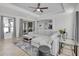 Spacious living room with large sectional sofa, tile floors, and open floor plan with high ceilings and modern ceiling fan at 11413 Camden Park Dr, Windermere, FL 34786