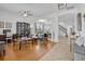 Open concept living area with hardwood and tile flooring, abundant natural light, and a seamless flow to the dining area and staircase at 11413 Camden Park Dr, Windermere, FL 34786
