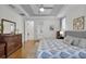 Spacious primary bedroom featuring tray ceilings, hardwood floors, and a comfortable bed with a neutral palette at 11413 Camden Park Dr, Windermere, FL 34786