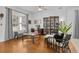 Home office featuring hardwood floors, built-in shelving, and ample natural light at 11413 Camden Park Dr, Windermere, FL 34786