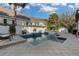 Backyard featuring a pool with lounge chairs and white fence in the background at 11413 Camden Park Dr, Windermere, FL 34786