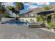 Backyard featuring a pool with lounge chairs and umbrella near a white fence at 11413 Camden Park Dr, Windermere, FL 34786