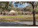 Street view of houses next to a waterway with manicured lawns and landscaping at 11413 Camden Park Dr, Windermere, FL 34786