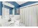 Clean bathroom with white vanity and blue walls at 11729 Whitewing Ct, Orlando, FL 32837