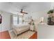 Spacious bedroom with ceiling fan and wood-look flooring at 11729 Whitewing Ct, Orlando, FL 32837