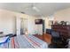 Bedroom with wood flooring and ensuite bathroom at 11729 Whitewing Ct, Orlando, FL 32837