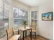 Bright breakfast nook with window seating and small table at 11729 Whitewing Ct, Orlando, FL 32837