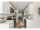 Modern kitchen with white cabinets and stainless steel appliances at 11729 Whitewing Ct, Orlando, FL 32837