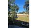 Large backyard with grassy area, fire pit, and swing set at 1216 Windward Dr, Apopka, FL 32703