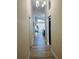 Bright hallway with light wood floors leading to living area at 1216 Windward Dr, Apopka, FL 32703