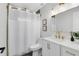 Bathroom featuring marble wall tile, gold fixtures, and a shower and tub combination at 1312 Surf Ave, Apopka, FL 32703