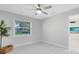 Bright bedroom with white trim, a view to the outdoors, and new wood-look flooring at 1312 Surf Ave, Apopka, FL 32703