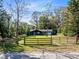 View of this secluded, single Gathering home featuring a large yard with a wooded perimeter at 1312 Surf Ave, Apopka, FL 32703