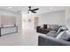 Bright and airy living room featuring modern decor, light floors, and a ceiling fan at 1312 Surf Ave, Apopka, FL 32703