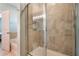 Shower with glass enclosure and neutral tile at 14694 Seton Creek Blvd, Winter Garden, FL 34787