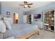 Bright bedroom with built-in shelving and ensuite bathroom at 14694 Seton Creek Blvd, Winter Garden, FL 34787