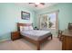 Bedroom with a wooden bed frame and a window with blinds at 14694 Seton Creek Blvd, Winter Garden, FL 34787