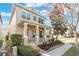 Two-story house with front porch, landscaping, and a light beige exterior at 14694 Seton Creek Blvd, Winter Garden, FL 34787