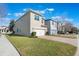 Tan two-story house with white garage door and paver driveway at 14694 Seton Creek Blvd, Winter Garden, FL 34787