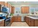 Modern kitchen with stainless steel appliances and granite countertops at 14694 Seton Creek Blvd, Winter Garden, FL 34787