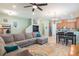 Open living room showcasing a sectional sofa, kitchen, and dining area at 14694 Seton Creek Blvd, Winter Garden, FL 34787