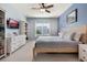 Spacious main bedroom with king bed, built-in shelving and dresser at 14694 Seton Creek Blvd, Winter Garden, FL 34787