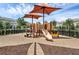 Community playground with shade structures and play equipment at 14694 Seton Creek Blvd, Winter Garden, FL 34787