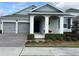 Two-story house with two car garage and landscaped front yard at 16368 Orange Seed Ln, Winter Garden, FL 34787