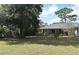 Large backyard with a spacious lawn and shed at 1821 Stanley St, Longwood, FL 32750