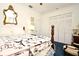 Bright bedroom with antique wooden bed and Parisian themed quilt at 1821 Stanley St, Longwood, FL 32750