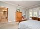 Bedroom with a view of an ensuite bathroom and patio at 1821 Stanley St, Longwood, FL 32750