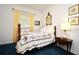 Bright bedroom featuring a bed with a quilt and a traditional lamp at 1821 Stanley St, Longwood, FL 32750
