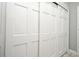 Closet doors with paneled detailing and neutral flooring at 1821 Stanley St, Longwood, FL 32750