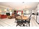 Open dining area with wood table and chairs, adjacent to the kitchen and living room at 1821 Stanley St, Longwood, FL 32750