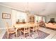 Bright dining room with a large table and chandelier at 1821 Stanley St, Longwood, FL 32750