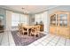 The spacious dining room has tile flooring, a decorative rug, and elegant furniture at 1821 Stanley St, Longwood, FL 32750