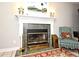 A cozy fireplace featuring an ornate mantel, decorative sconces, and an emerald green tile surround at 1821 Stanley St, Longwood, FL 32750