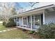 Charming front porch with rocking chairs and green shutters at 1821 Stanley St, Longwood, FL 32750