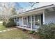 Charming home with rocking chairs on the front porch at 1821 Stanley St, Longwood, FL 32750